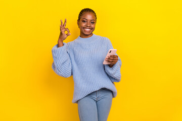 Sticker - Photo of young cornrows hairdo girl dressed blue jumper showing okey sign meaning everything good isolated on yellow color background