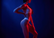 © standret - Fitness type body. Young woman in underwear is in the studio with neon lights