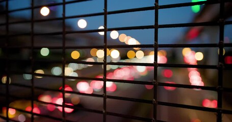 Wall Mural - Wire fence in front of the night city