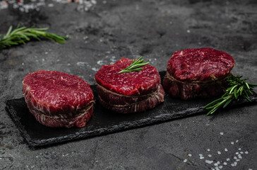 Canvas Print - Beef medallions with rosemary and spices, Food recipe background. Close up