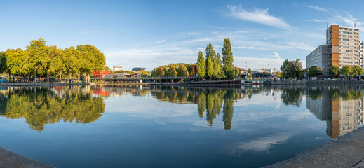 Wall Mural - Paris, France - 11 07 2022: La Villette Park. View of the Canal of the Basin of the villette with reflects