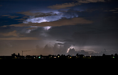 Wall Mural - thunderstorm is illuminated by flashes of lightning
