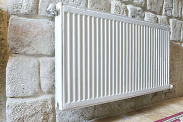 Wall Mural - White radiator in an apartment. Radiator.