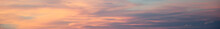 Long Horizontal Abstract Cloud Banner. Bright Orange And Pink Sunset Sky. Copy Space.