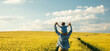 © Masson - father and son in wheat field, child sitting on his fathers shoulders