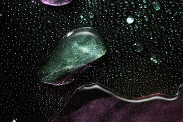 Wall Mural - close up of water droplet on glitter surface