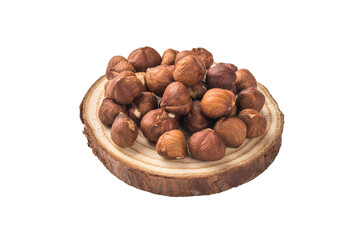 Wall Mural - Wooden stand and hazelnuts isolated on a white background.