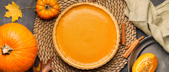 Wall Mural - Composition with tasty pumpkin pie on wooden background. Thanksgiving Day celebration