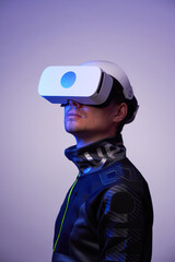 Poster - Man is using virtual reality headset. Concept of virtual, augmented and extended reality and metaverse.