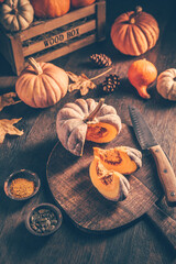 Wall Mural - Pieces with ripe pumpkin seeds on a cutting board