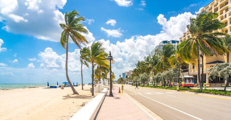 Seafront beach promenade with palm trees on a sunny day in Fort Lauderdale