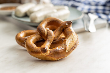 Wall Mural - Baked bavarian pretzels on white table.