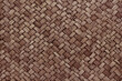 © Tumm8899 - Old dark brown bamboo weave texture background, pattern of woven rattan mat in vintage style.