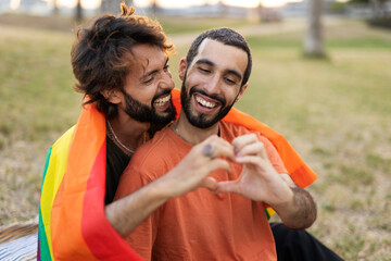 Wall Mural - Happy couple with a pride flag. LGBT community