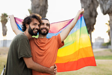 Wall Mural - Happy couple with a pride flag. LGBT community