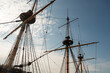 Masts, yards and rigging of sailing ship against blue sky