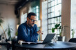 © bnenin - Focused businessman looking at the laptop, working over it.