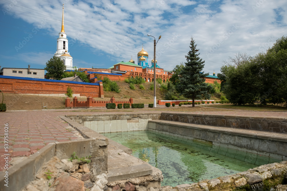 Open pool with spring water at the walls of the Zadonsky Nativity of ...