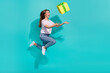 Full size photo of lovely ecstatic gorgeous woman wear striped t-shirt throw up present hurry running isolated on teal color background