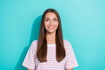 Wall Mural - Photo of adorable positive cute girl with straight hairdo dressed striped t-shirt look empty space isolated on turquoise color background