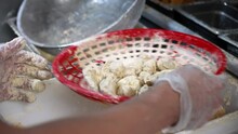 Fry Cook Uses Red Basket As Strainer To Bread Raw Shrimp, Slow Motion 4K