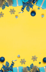 Wall Mural - christmas background with pine tree, gifts and festive decorations top view. christmas flat lay. cop