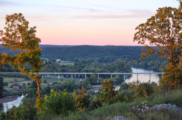 Wall Mural - A beautiful fall evening looking out over the White River and surrounding area from Cotter, Arkansas as the sun is setting in the background