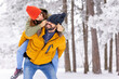 © Impact Photography - Boyfriend piggybacking girlfriend in the snow