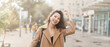 © olga pink - Lifestyle portrait pretty Asian kazakh woman with brilliant smile on street