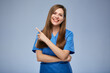 © Yuriy Shevtsov - Smiling nurse woman pointing finger at side. Isolated female portrait.