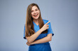 © Yuriy Shevtsov - Smiling nurse woman pointing finger at side. Isolated female portrait.