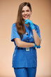 Young doctor surgeon woman in blue medical suit. Isolated portrait of nurse.