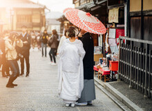 A Japanese Couple On Their Wedding Day Dressed Up In Traditional Kimono Taking Photo Shots In Kyoto