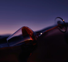 3d Rendered Illustration Of Glass Of Wine On  Ocean Surface