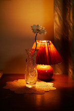 A Flower Vase And A Vintage Lamp 