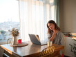 © ZHPH Production/Stocksy - Woman working on laptop from home