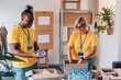 © Zamrznuti tonovi - Group of multiracial volunteers working in community charity donation center