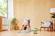 © ALTO IMAGES/Stocksy - Unrecognizable woman practicing Downward facing dog