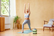 © ALTO IMAGES/Stocksy - Sportive woman practicing Crescent Lunge asana