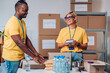 © Zamrznuti tonovi - Group of multiracial volunteers working in community charity donation center