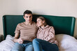 © Alberto Bogo/Stocksy - Couple Cuddling In Bed