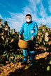 © Ezequiel Giménez/Stocksy - Senior farmer working on vineyard