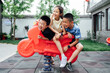 © MaaHoo Studio/Stocksy - Kids playing together in the yard