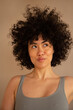 © ohlamour studio/Stocksy - Woman with curls and natural skin