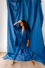 Graceful Woman In Stylish Blue Clothes In Studio