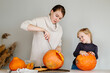 © Sergey Narevskih/Stocksy - Family preparing to Halloween