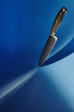 Knife Stuck In Blue Background