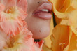 © Liliya Rodnikova/Stocksy - Sensual lips of anonymous woman and tender flowers