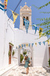 © Hernandez & Sorokina/Stocksy - Woman Having A Walk In Greece