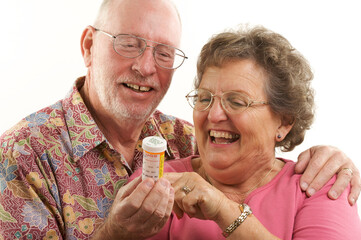 Wall Mural - Smiling Senior Couple with a Prescription Bottle